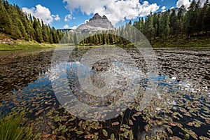 Italian  Lago d`Antorno or Antorno Lake summer nature photo with stunning Tre Cime di Lavaredo 2999m peaks on the background in