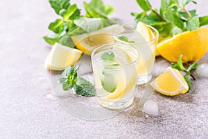 Italian lemon lime liqueur limoncello with ice and mint