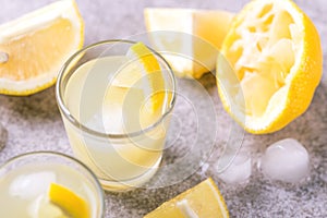 Italian lemon lime liqueur limoncello with ice and mint