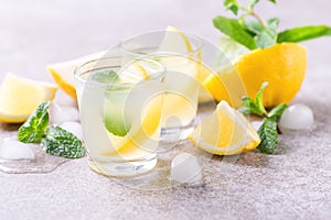 Italian lemon lime liqueur limoncello with ice and mint