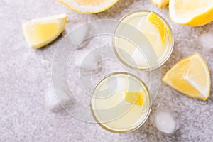 Italian lemon lime liqueur limoncello with ice and mint