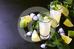 Italian lemon lime liqueur limoncello with ice and mint