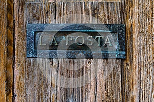 Italian letterbox with the text La Posta, letters in Italian