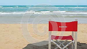 Italian lifeguard vacant red chair