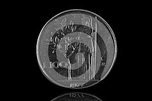 100 italian lira coin from 1977 isolated on black