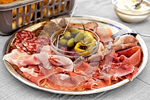 Italian Lunch sliced meat affettati, cold cuts, luncheon, prosciutto, cured pork photo