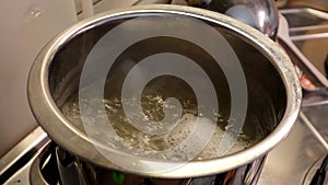 Italian macaroni pasta in pot with boiling water