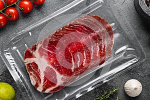 Italian meat cold cuts pack, on gray stone table background, top view flat lay