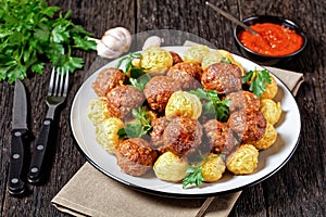 Italian meatballs and pasta balls on a plate