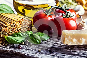 Italian and Mediterranean food ingredients on old wooden background.