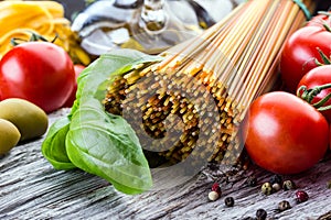 Italian and Mediterranean food ingredients on old wooden background.