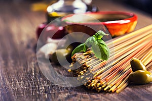 Italian and Mediterranean food ingredients on old wooden background.