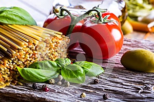 Italian and Mediterranean food ingredients on old wooden background.