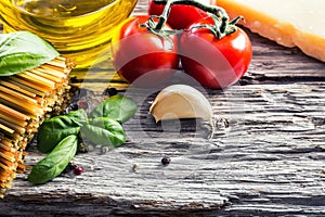 Italian and Mediterranean food ingredients on old wooden background.