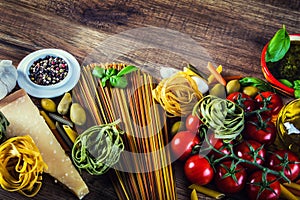 Italian and Mediterranean food ingredients on old wooden background.