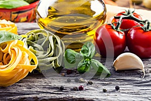 Italian and Mediterranean food ingredients on old wooden background.