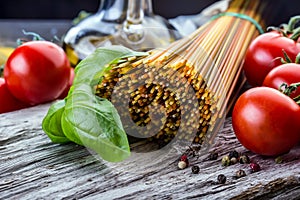 Italian and Mediterranean food ingredients on old wooden background.