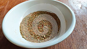 Italian mix herbs in a white ceramic bowl