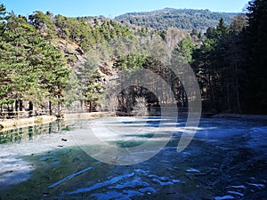 Frozen mountain lake in Susa Valley photo