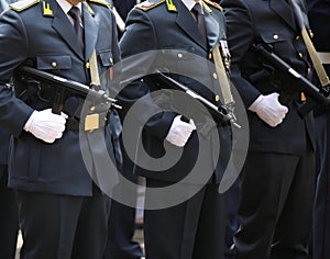italian officers of the financial police in uniform and machine photo