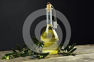 Italian olive oil in bottles with aromatic herbs