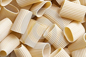 Italian paccheri pasta raw uncooked food background