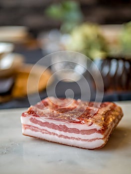 Italian pancetta, seasoned bacon. Pork belly curated meat.