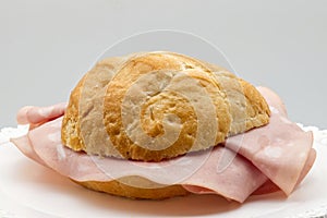 Italian panino alla Mortadella. Mortadella sandwich. Close-up