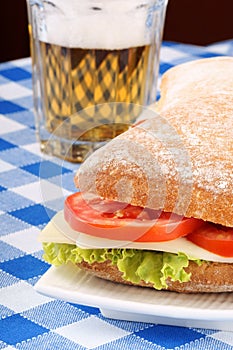 Italian panino sandwich and beer