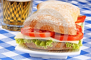 Italian panino sandwich and beer