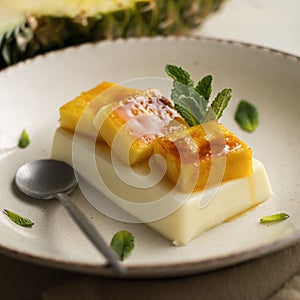 Italian Panna Cotta with caramelized pineapple.