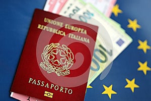 Italian passport of European Union and airlines tickets on blue flag background close up