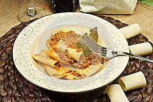 Italian pasta called `Paccheri` with meat souce