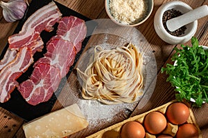 Italian Pasta Carbonara Preparation Ingridients. Wooden background. Top View.