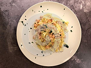 Italian Pasta. Delicious Tagliatelle with salmon and sauce.