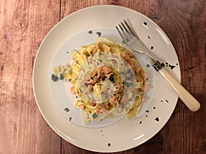 Italian Pasta. Delicious Tagliatelle with salmon and sauce.