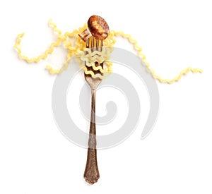 Italian pasta design. An overhead photo of a vintage style fork with long fusilli and a fried mushroom on a white background