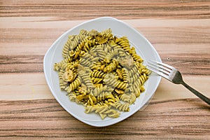 Italian pasta dish with yellow sauce and mushrooms