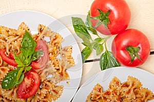 Italian pasta farfalle butterfly bow-tie and tomato sauce