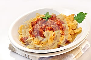 Italian pasta farfalle with meat and tomato sauce