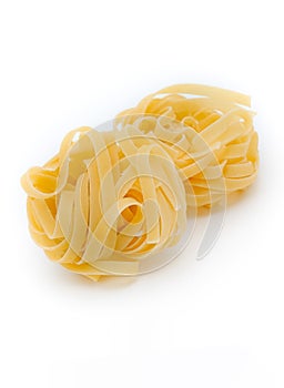 Italian pasta fettuccine nest isolated on white background