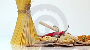 Italian pasta, Italian pasta ingredients, flour, pasta assortment of olive oil in a bottle, still life, spices spaghetti, studio