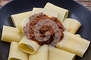 Italian Pasta Paccheri with Chianina ragout. Close-up