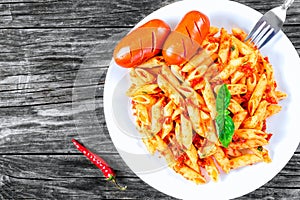Italian Pasta Penne with sausages and Sun-Dried Tomato Pesto