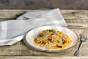 Italian pasta in a plate, tasty and spicy spaghetti. Tomato, parmesan, garlic.