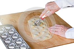 Italian pasta. Preparation of tortelli with spinach and ricotta