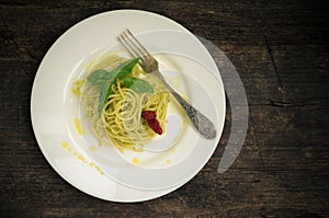 Italian pasta spaghetti with homemade pesto sauce and basil leaf