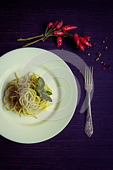 Italian pasta spaghetti with homemade pesto sauce and basil leaf