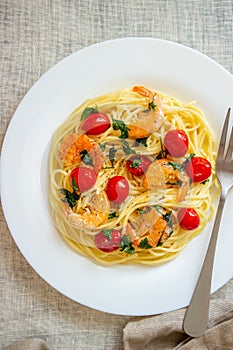 Italian pasta spaghetti with shrimps and tomatoes. National cuisine