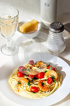 Italian pasta spaghetti with shrimps and tomatoes. National cuisine